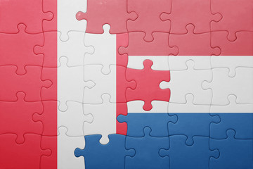 puzzle with the national flag of netherlands and peru