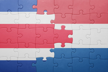 puzzle with the national flag of netherlands and costa rica