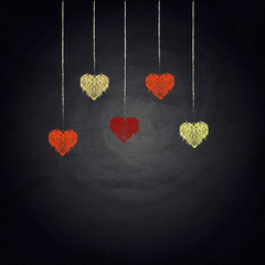 Drawing bunting hearts on blackboard background