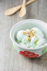 ice cream with peanuts in ceramic bowl