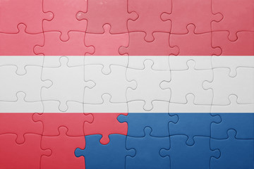 puzzle with the national flag of netherlands and austria