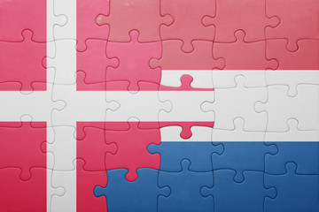 puzzle with the national flag of netherlands and denmark