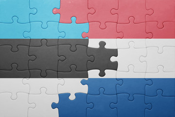 Fototapeta premium puzzle with the national flag of netherlands and estonia