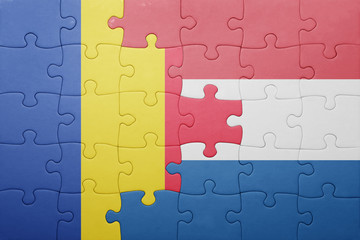 puzzle with the national flag of netherlands and romania