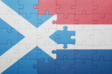 puzzle with the national flag of netherlands and scotland