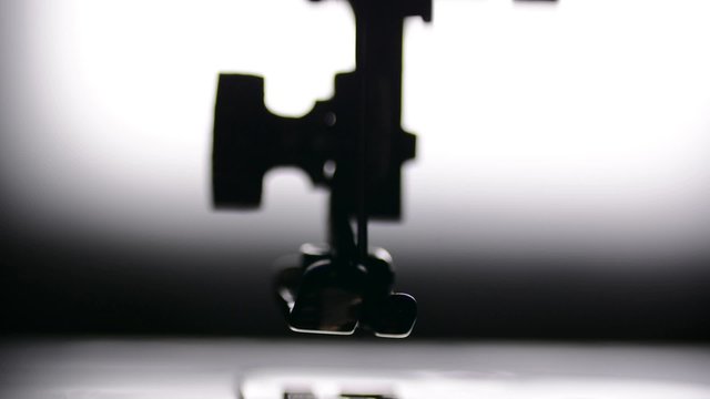 Vintage sewing machine. Mechanical parts, close up footage.