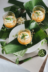 Noodlse with fish curry sauce,shallow Depth of Field,Focus on basil leaf.
