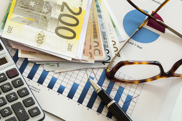 Business chart and eyeglasses