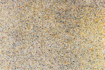 close up of wet gray gravel road or ground