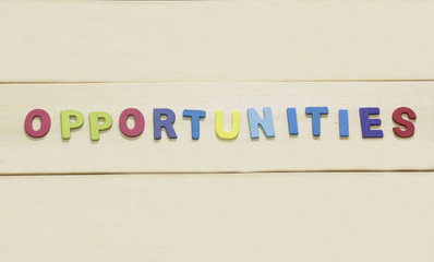 The colorful word "Opportunities " on wood background : SWOT Con