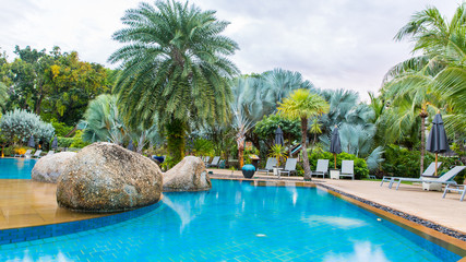 Beautiful swimming pool in tropical resort , Phuket, Thailand.