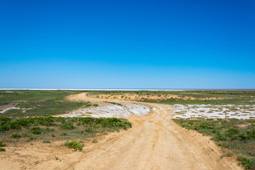 Fototapeta na wymiar Dirt road to the salt lake Elton.