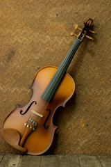 Fototapeta na wymiar Vintage violin with old steel background with copy space