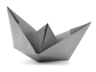 Black paper navigation origami sail boat isolated on white background