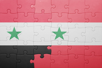 puzzle with the national flag of syria and austria