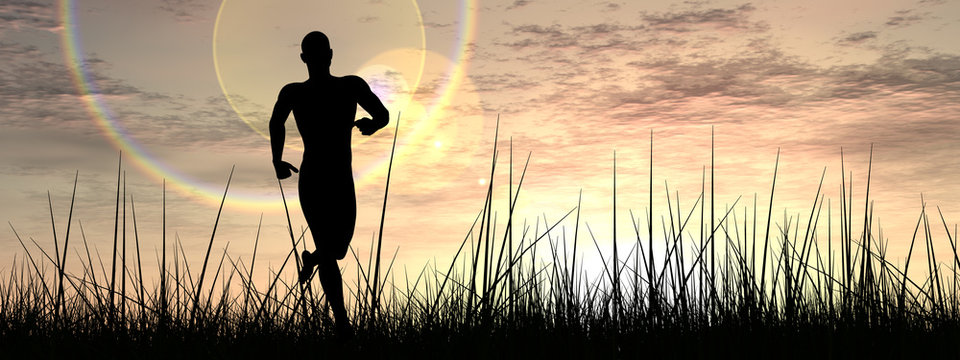 Conceptual man running in grass at sunset