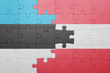 Fototapeta premium puzzle with the national flag of estonia and austria
