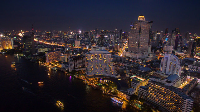 aerial night scene of bangkok sky scraper beside chaopraya river