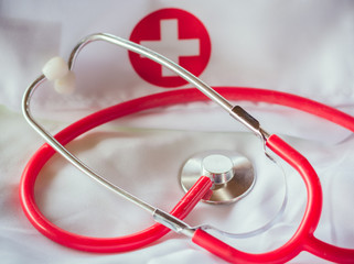 red stethoscope on a lab coat II