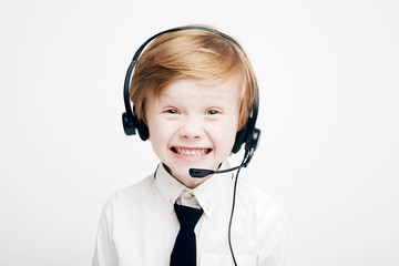 Cute little boy in headphones with microphone