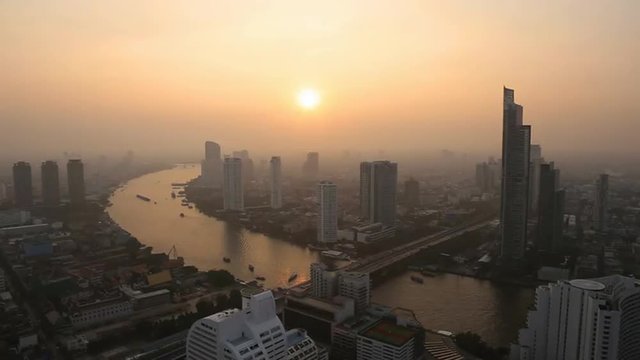 Hazy Sunset over Bangkok Skyline with the Chao Phraya River, Thailand