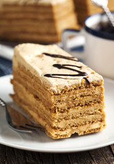 Piece of honey cake with cream of condensed milk