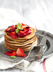 Stack of pancakes with fresh strawberry and balsamic glase