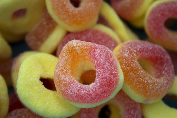 This is a photograph of sour peach candy rings