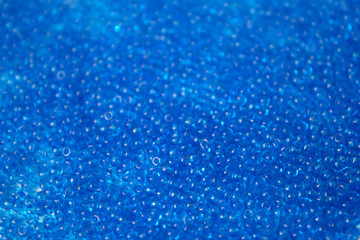 Fototapeta na wymiar This is a closeup photograph of blue Glass seed beads background