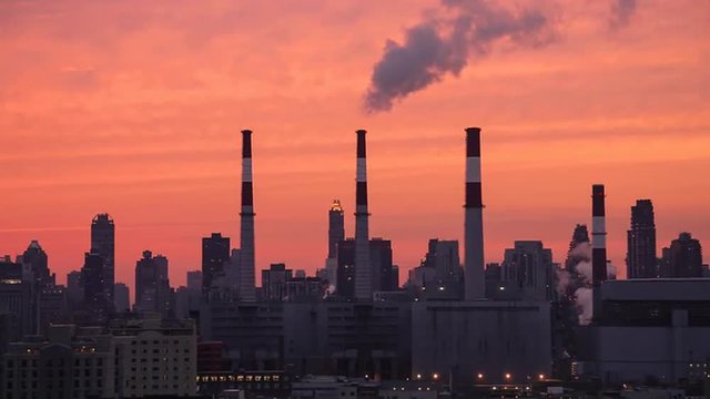 Fumes Coming out of Power Plant Chimneys in Queens and Highrises of Manhattan as Seen from Long Island City at Sunset (New York City)