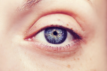 Fototapeta premium Beautiful insightful look blue woman's eyes