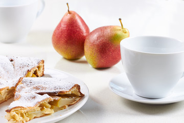 delicious pear tart with coffee on the table