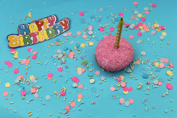 Cupcake on blue confetti background - happy birthday card