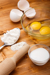 Fototapeta na wymiar Flour, eggs and salt on the wooden table
