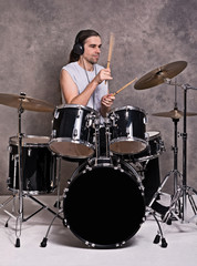 Fototapeta na wymiar musician with his black drum set