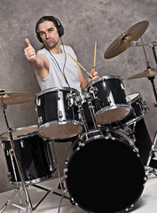 musician with his black drum set