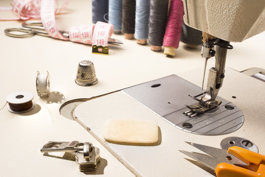 Tailor, tailoring table and utensils. High resolution image.