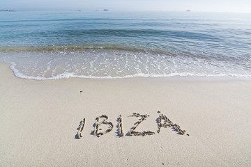Ibiza written in sand