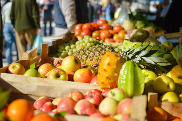 Many different fruits at a farmers market background