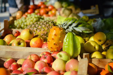 Many different fruits at a farmers market background