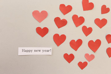 Happy new year greeting card with hearts and text