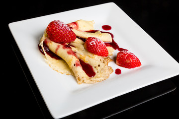 Pancake with strawberry sauce.