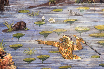the Ramayana painting on the wall in public temple Wat Phra Kaew in Thailand