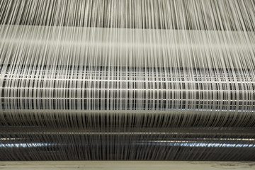 Yarn warping machine in a textile weaving factory