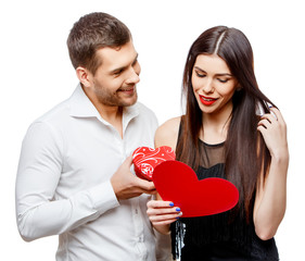 Young beautiful couple with present isolated on white