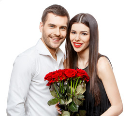 Young beautiful couple with flowers isolated on white