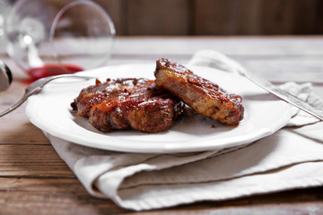 Roasted beef fillet on plate, on wooden background