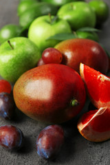 Fototapeta na wymiar Fruits on dark grey background