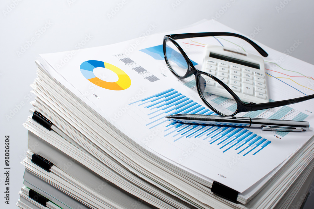 Poster Data management. Document management. Business concept.Pile of documents on gray background. Graph, glasses, calculate and pen.
