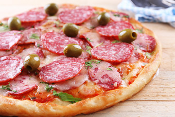 Delicious tasty pizza with cutter and shovel, closeup